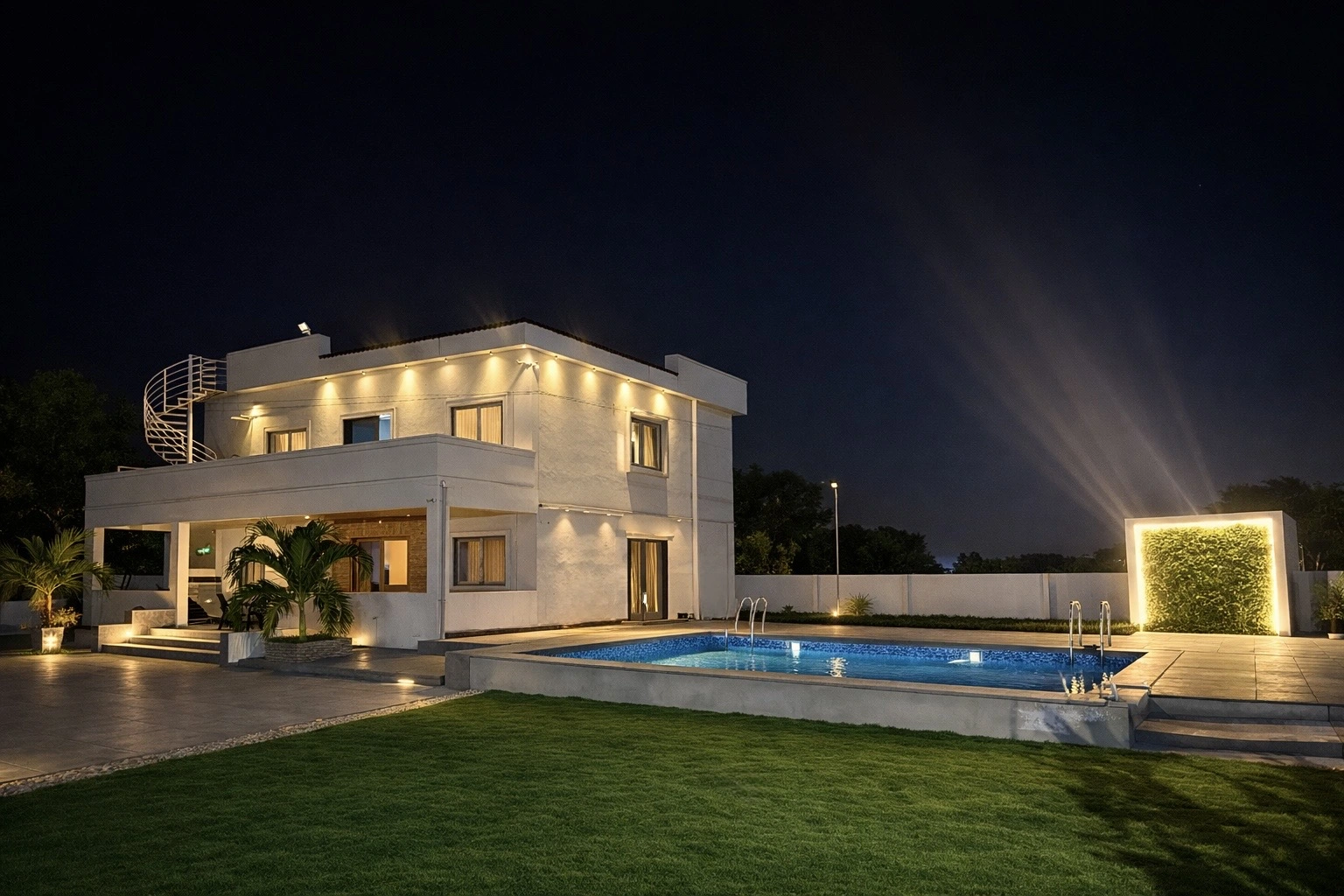 Shri Farms luxury farmhouse exterior with pool at night